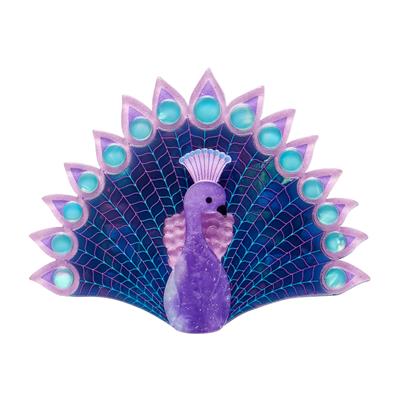 Decorative peacock feather with purple and blue colors on a white background