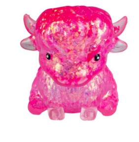A small pink bull figurine made of glittery, translucent pink material, shown against a plain white background.