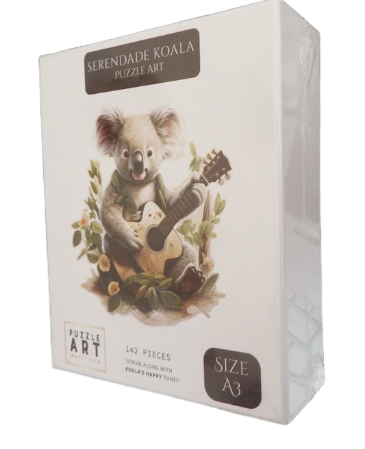 Box of Serenade Koala Puzzle Art with a koala playing guitar on a white background