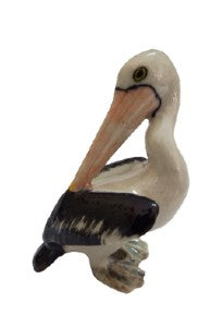 Pelican looking behind ceramic miniature figurine